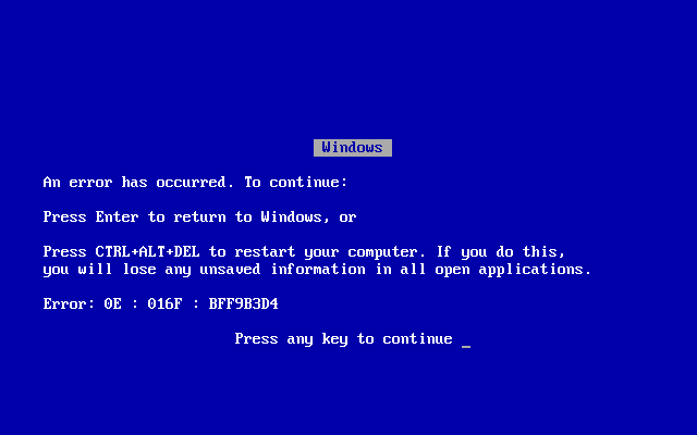 A computer with a crash error message.