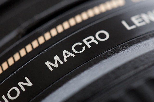 Close-up of a magnifying glass examining intricate text on a document (Attention To Detail)