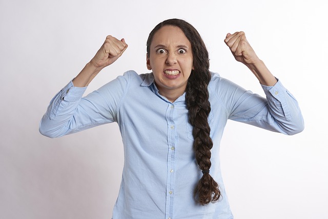 A frustrated woman raised her fists angrily