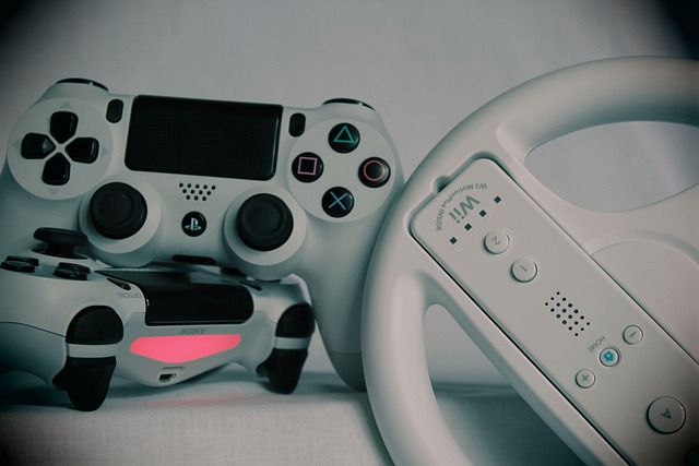 PlayStation controllers and a Wii wheel gaming controller