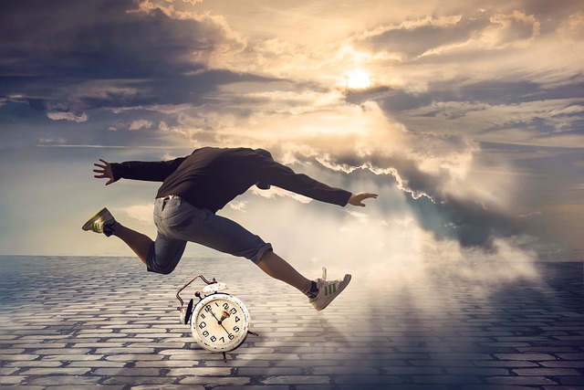 A person jumping over an alarm clock outdoors