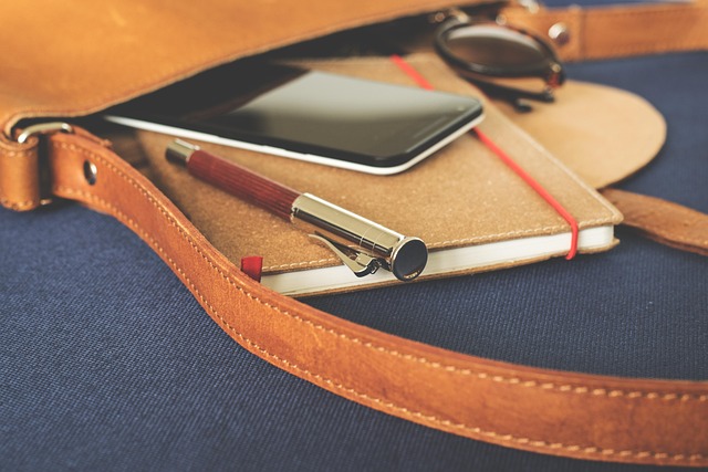 Person reviewing a calendar and to-do list, making notes for adjustments to their 90-day plan