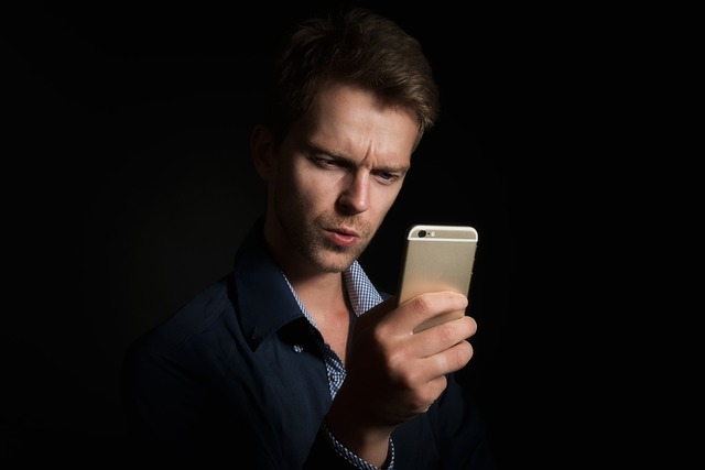 Person using a world clock app on a smartphone to check time zones