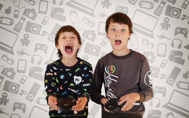 Two surprised boys holding video game controllers against a tech background