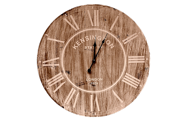 A vintage wooden wall clock with Roman numerals