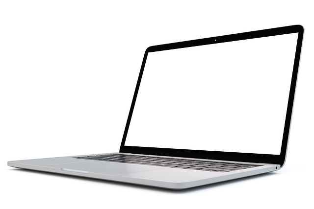 Close-up of a laptop screen showing a few black dead pixels clustered in a corner. (laptop screen corner dark)