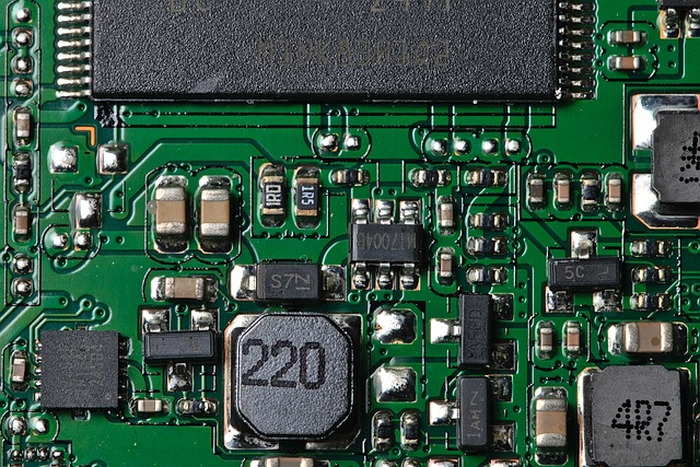 Macro view of a green printed circuit board with electronic components