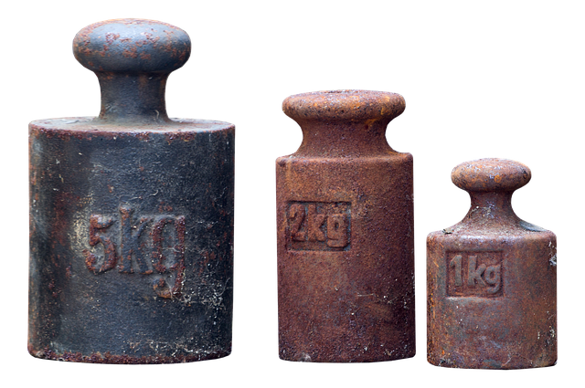 Three vintage rusty kilogram scale weights