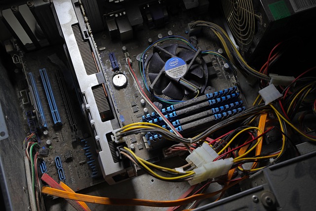 Photo of a computer motherboard with a graphics card installed, showing clean power cable connections and the PCIe slot.