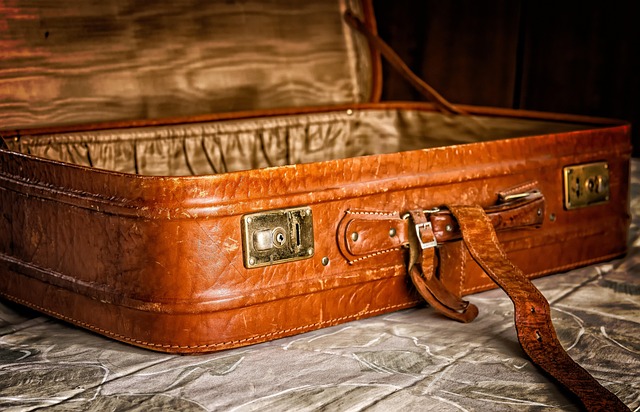 An open vintage brown leather suitcase