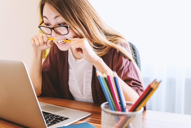 Student using Loop Earplugs while studying at a desk